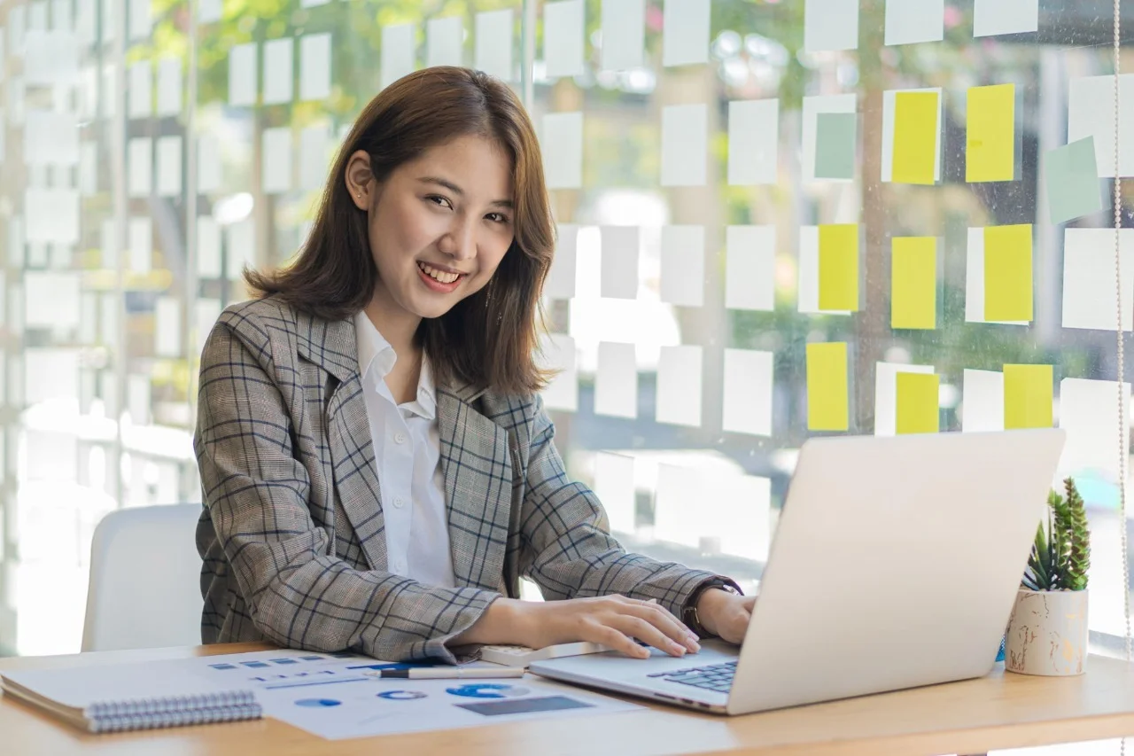 Professional working on a laptop in a modern office